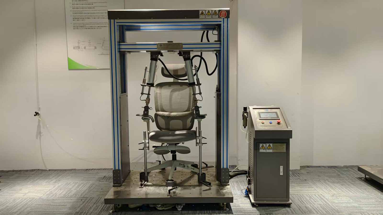 Arm-strength testing a chair in the ErgoSeat test room